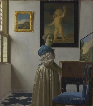 ヨハネス・フェルメール Painting - ヴァージナル・バロックの前に立つ若い女性 ヨハネス・フェルメール